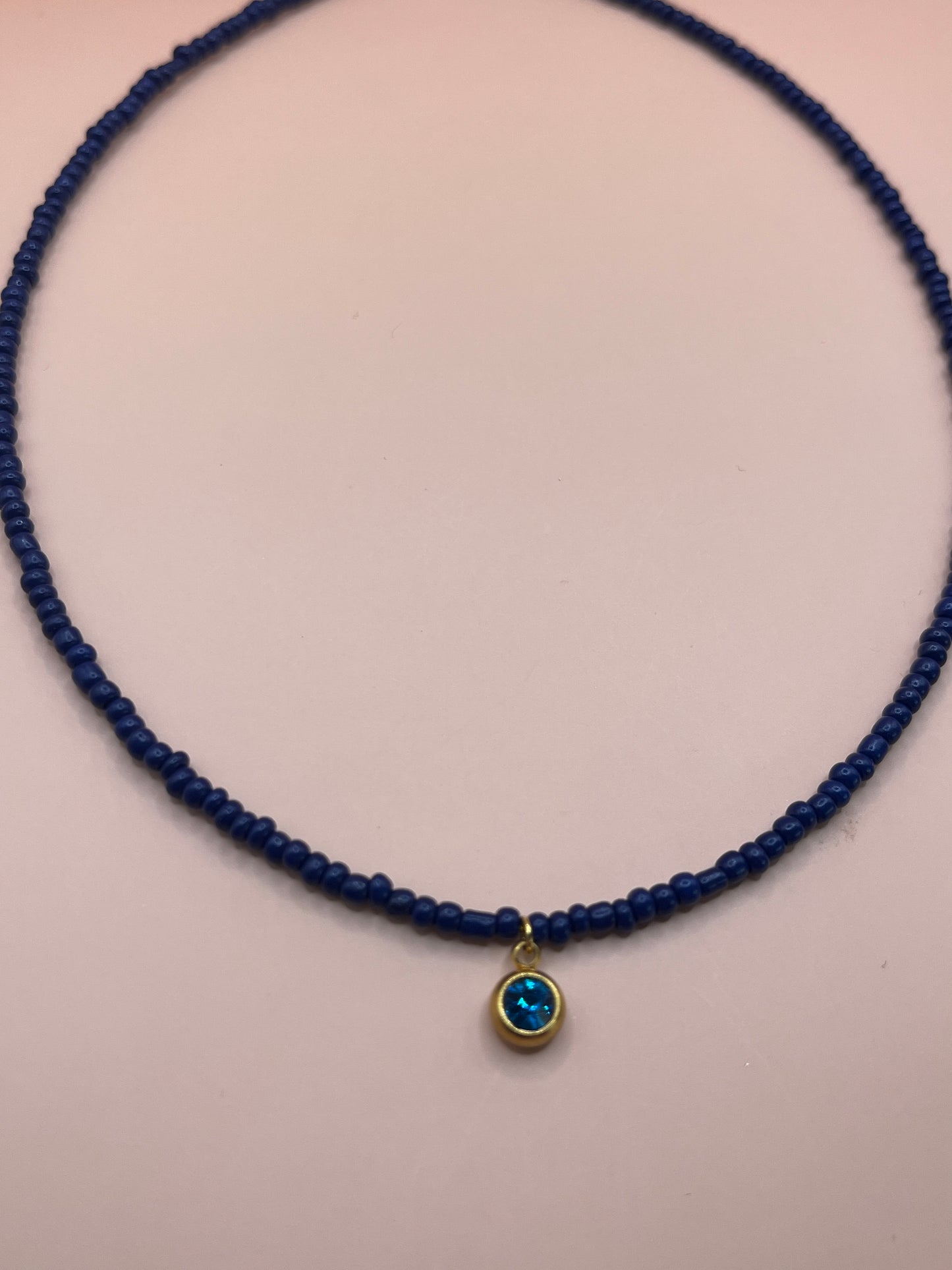 collier medaillon perle
