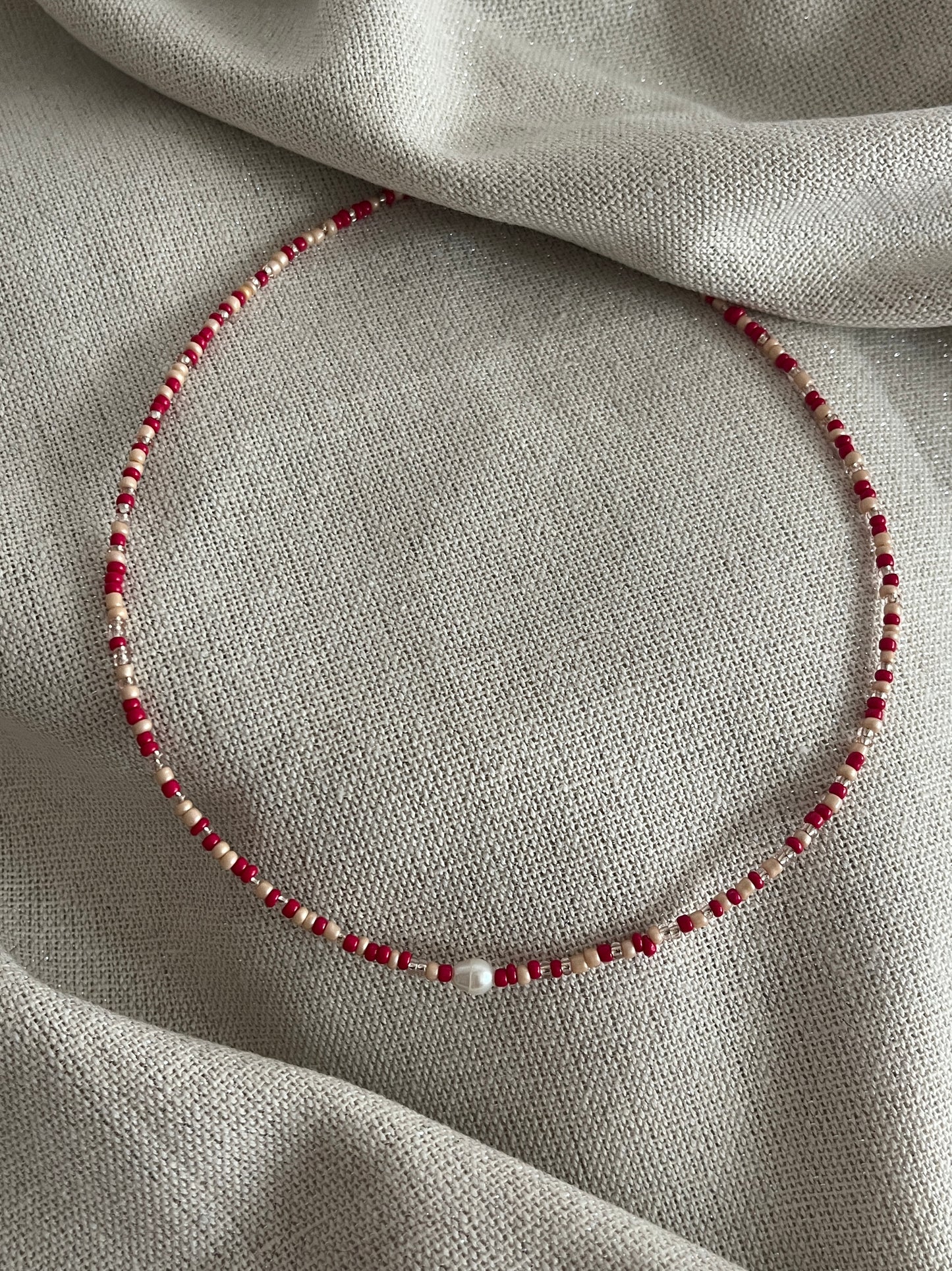 collier perles rouge brille