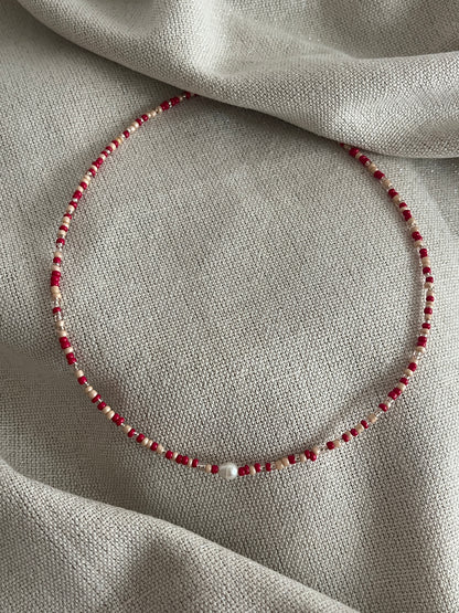 collier perles rouge brille
